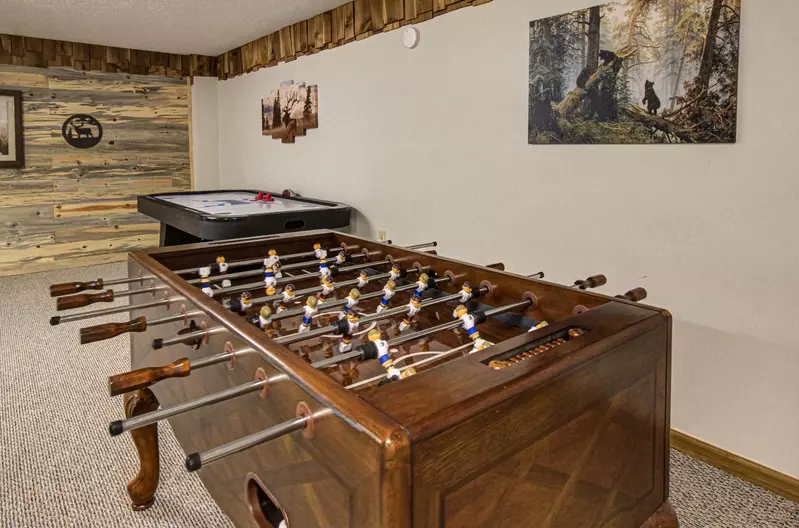 Families love staying at Bear Retreat because of the game room and other amenities this family cabin rental in Wears Valley offers.